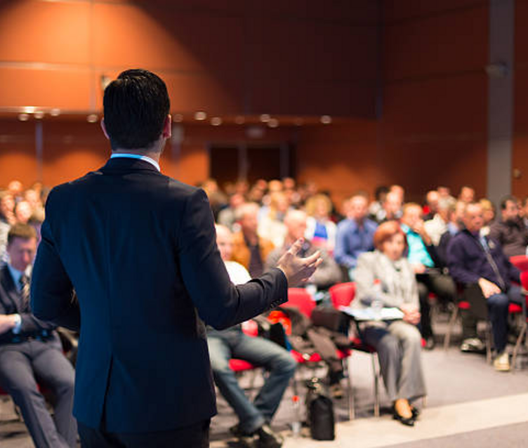 Speaker addressing a conference audience